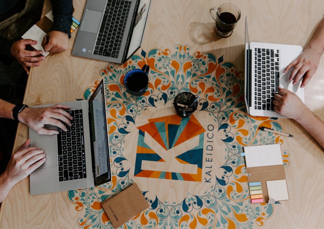 three-person-using-laptops-wnf-ljijg0e